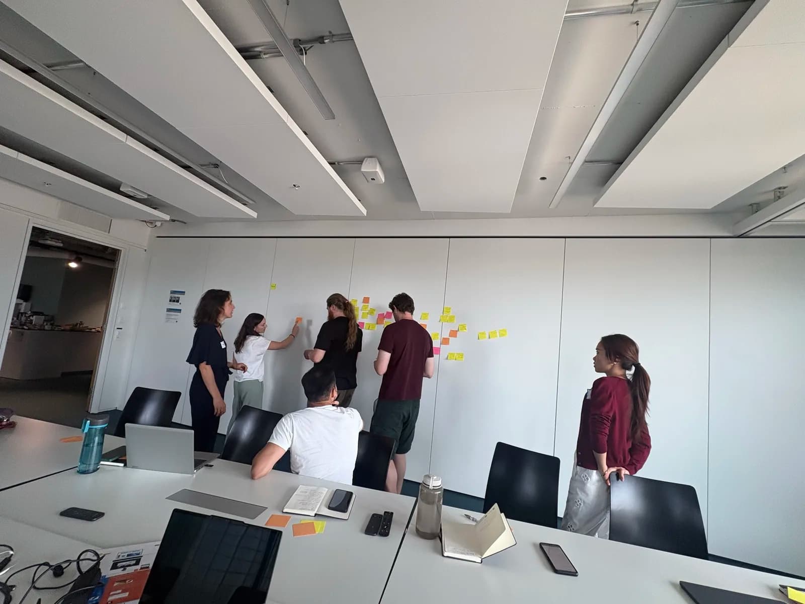 Participants clustering sticky notes during the working-group session